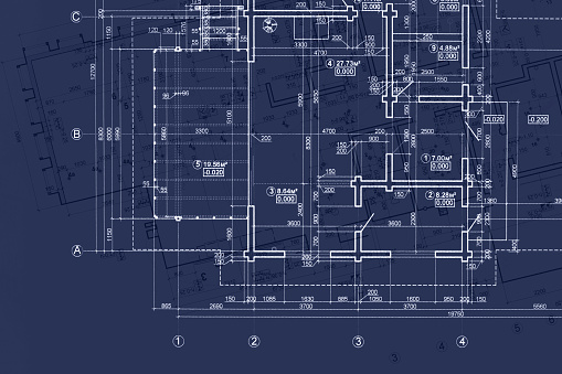 house blueprint on architects desk, engineering drawings and plans on dark blue background