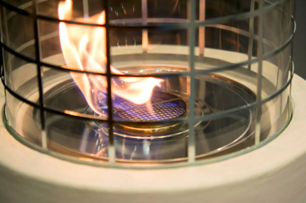 istock Modern bio fireplot fireplace on ethanol gas. Flame gas stove close-up 941079030
