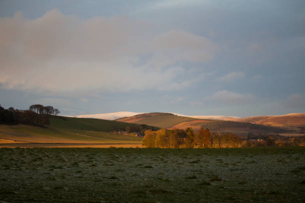 istock Snowy Glens behind Farmland 941081392