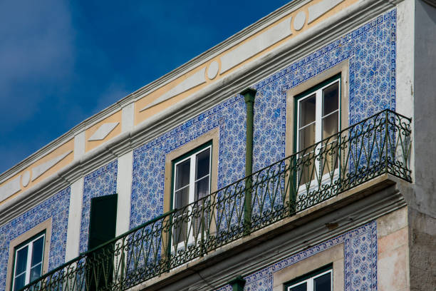 istock Old building facade with Lisbon traditional tiles 941084996