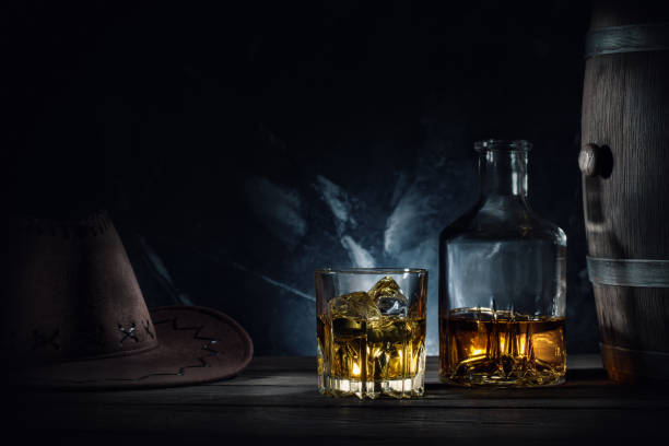 istock Whiskey and hat and barrel on dark background 941085560