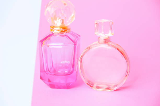 istock Two women perfumes isolated with white empty space 941085912