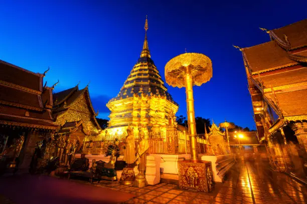 Photo of Wat Phra That Doi Suthep temple is a popular temple of Chiang Mai, Thailand at sunset.