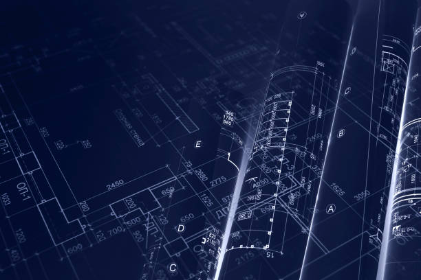 istock house project plan, blueprint rolls for civil engineering background. blue toned image. 941087102