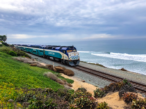 Del Mar, USA -  January 08, 2018: Coaster Commuter train on Del Mar beach, California, USA
