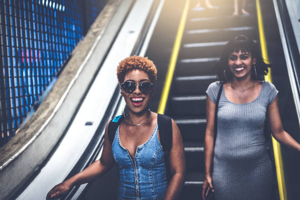 istock Two Students Looking at Camera at metro station 941090388