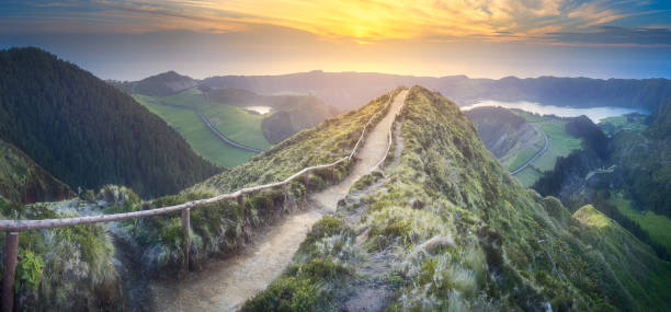 Sao Miguel Island and lake Ponta Delgada, Azores Mountain landscape with hiking trail and view of beautiful lakes, Ponta Delgada, Sao Miguel Island, Azores, Portugal panoramic country road single lane road sky stock pictures, royalty-free photos & images