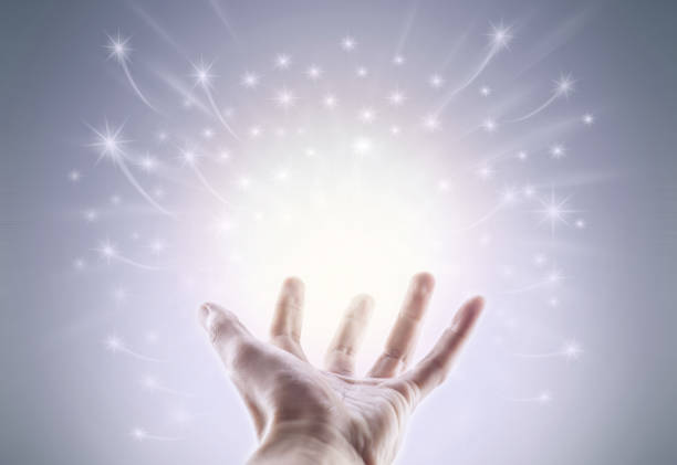 istock glowing light in hand like a wizard magical powerful 941093562