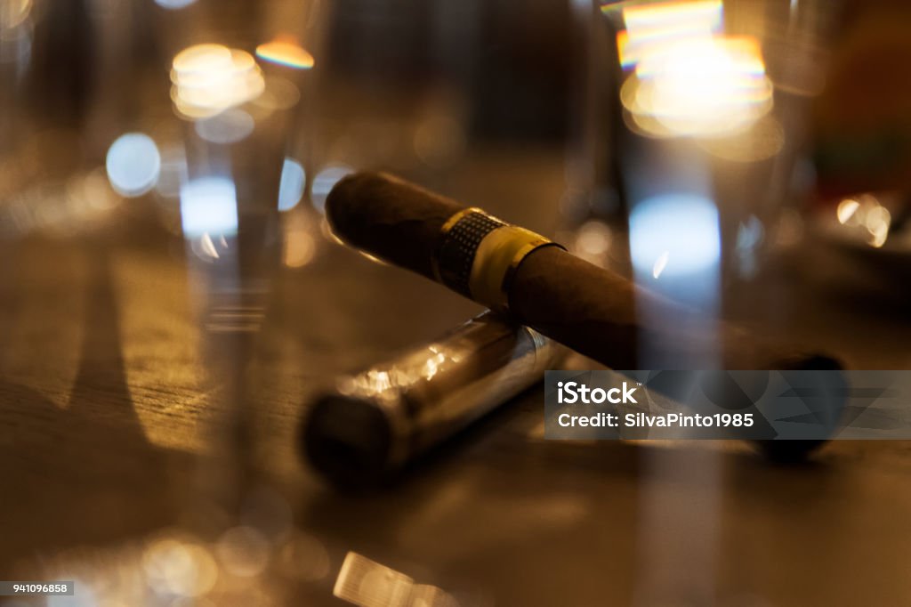 Close up of cigars on bar table with blurred background. Cigar Stock Photo