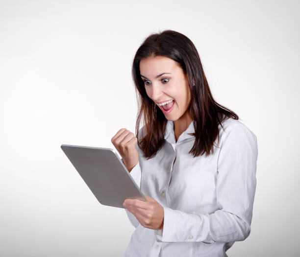 istock happy  businesswoman with digital tablet 941105612