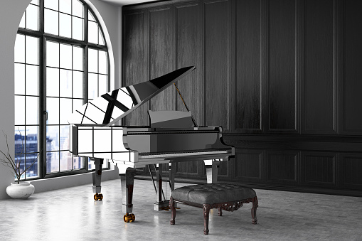 Piano in empty black room