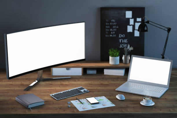 istock Home office desk with computer monitor and laptop 941108714