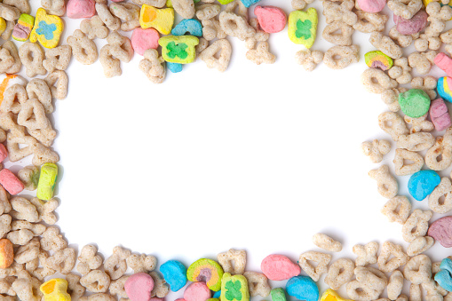 Frosted toasted oat cereal with fun shaped marshmallows on white background. blank space for texts.