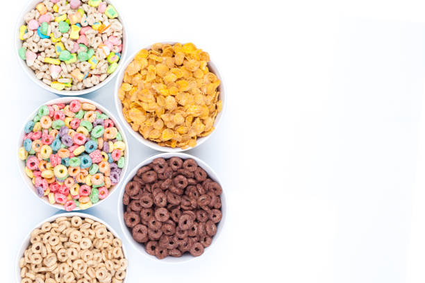 istock Five bowls of cereals on white background top view 941115316