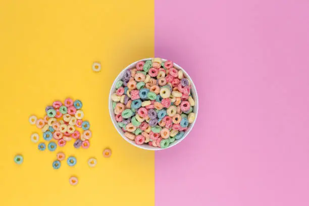 Photo of Bowl of colorful cereals top view