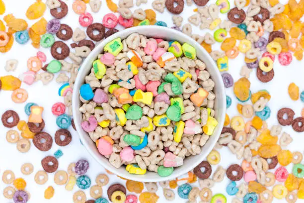Photo of Bowl of cereals and marshmallows on white background