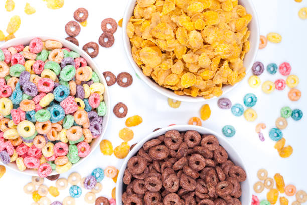 istock Three bowls of cereals on white background 941115650