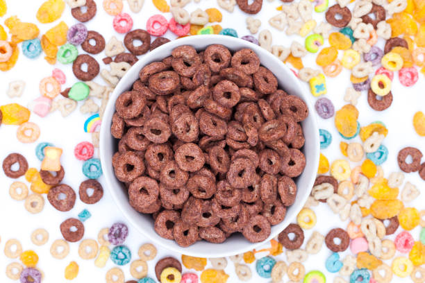 istock Bowl of chocolate cereals on white background 941115682