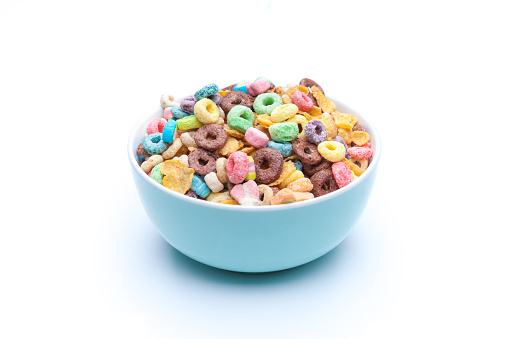 Bowl of mixed cereals,chocolate,corn flex,honey rings, and marshmallows  on white background. Isolated.