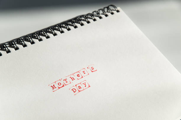 istock mothers day text on white sheet made via stamp 941121220