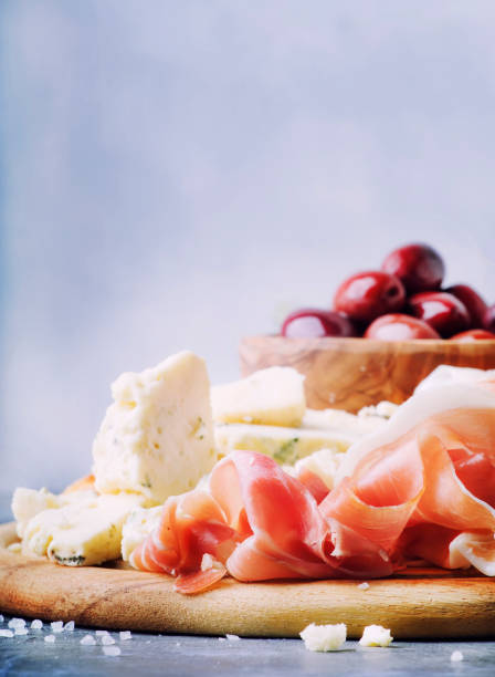 istock Snacks or antipasti, crostini, prosciutto, blue cheese and olives 941124526