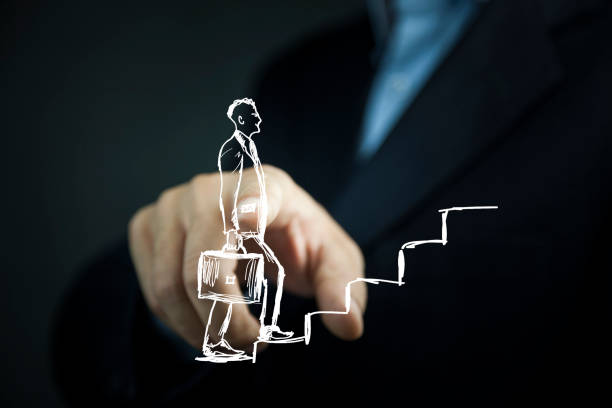 istock human hand drawing career ladder with chalk 941124734