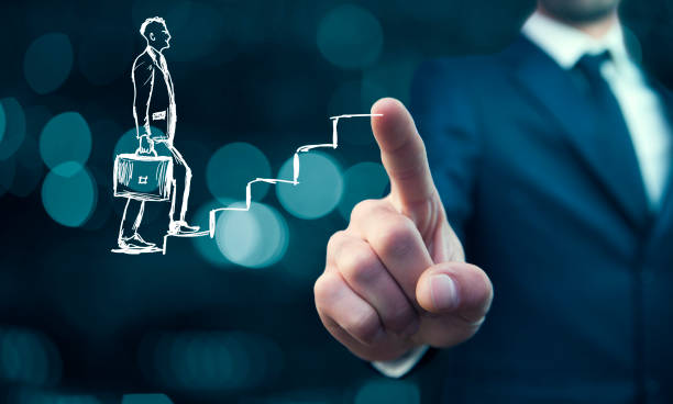 istock human hand drawing career ladder with chalk 941124774