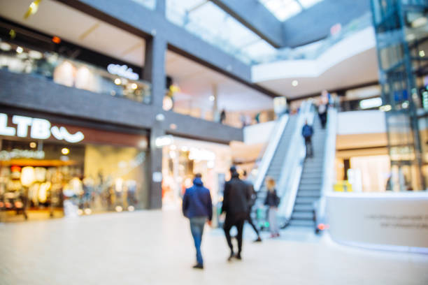 modern shopping center. blurred. out of focus. - department store imagens e fotografias de stock