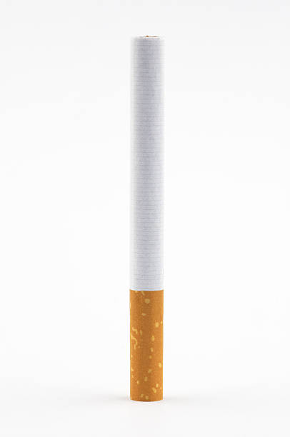 one cigarette on white background stock photo