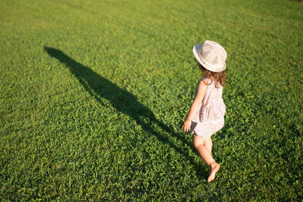 istock Little girls playing on the lawn 941137342