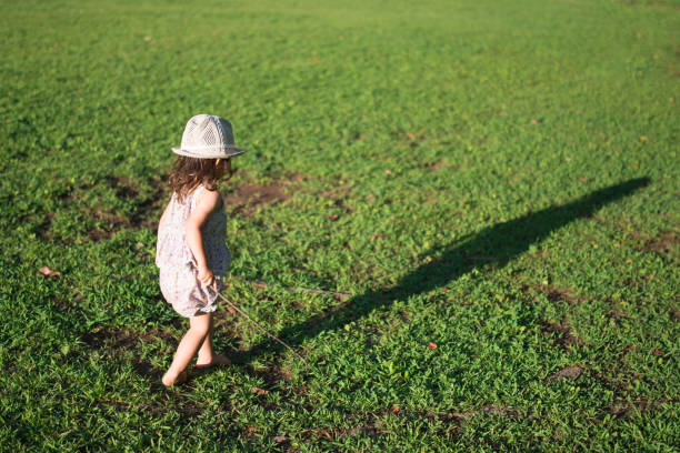 istock Little girls playing on the lawn 941137496