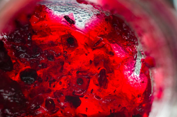 istock Bright translucent red currant jam in a glass jar 941140474