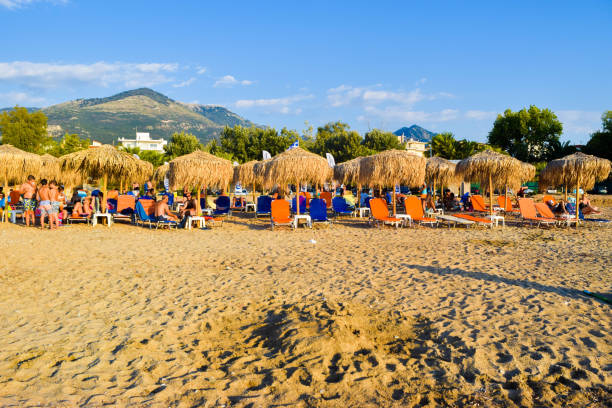 Greece - July 20, 2017: Vacationers sunbathe on the beach of Kyparissia.