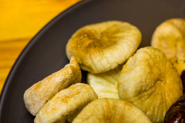istock dried figs in a ceramic plate on a wooden table 941143908