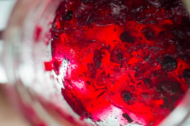 istock Bright translucent red currant jam in a glass jar 941144180