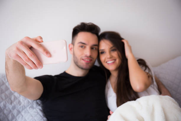 istock a loving couple at home 941145766