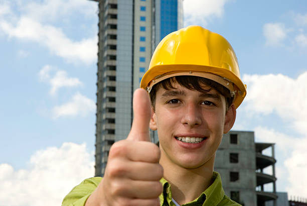 A male construction worker giving a thumbs up. Good work! stock photo