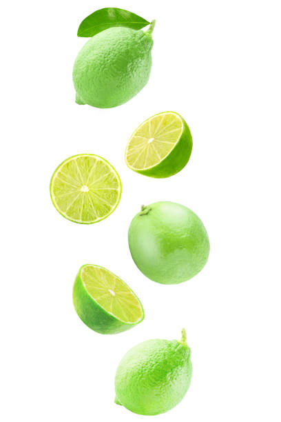 Fresh falling lime isolated on white background with clipping path stock photo