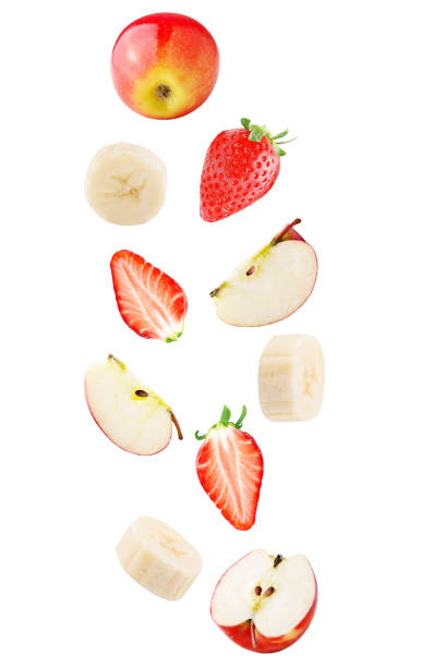Falling apple, banana and strawberry fruit isolated on white background stock photo