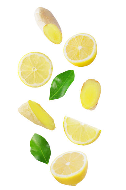 Fresh falling lemon and ginger isolated on white background stock photo