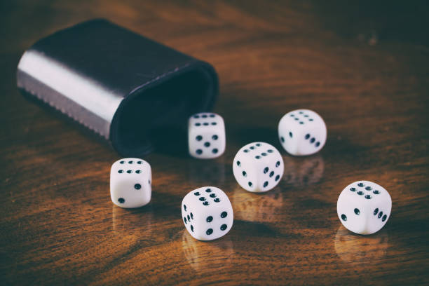 istock Playing dice on a wooden table. Retro style 941166276