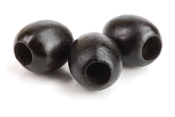 istock whole black olives isolated on white background macro 941167874