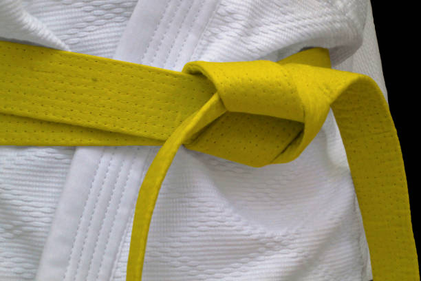 Yellow obi sash Close-up on a yellow belt tied around a kimono. yellow belt stock pictures, royalty-free photos & images