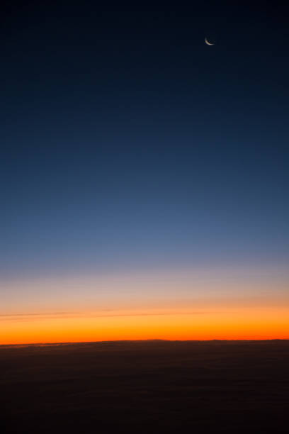 istock Sunset as seen from airplane above clouds 941171556