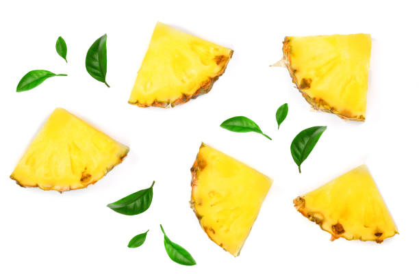 istock Sliced pineapple decorated with leaves isolated on white background. Top view. Flat lay pattern 941175010