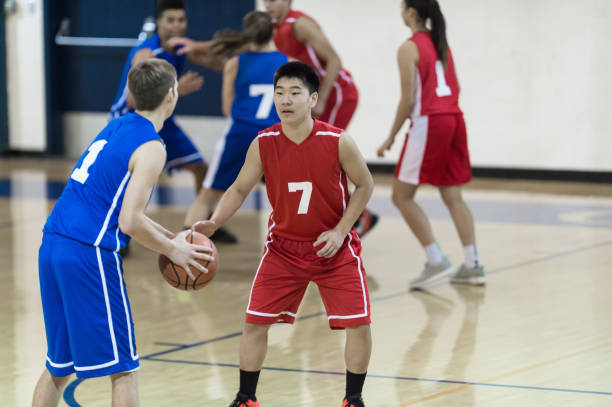 istock Action-Packed Co-ed High School Basketball Game 941175562