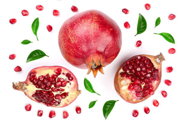 istock pomegranate with leaves isolated on white background. Top view. Flat lay pattern 941175764