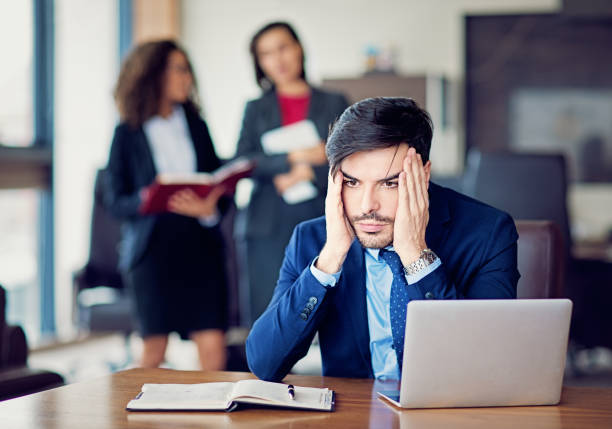istock Burnout businessman under pressure in the office 941178500