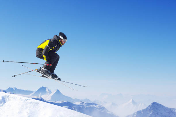 istock Jumping skier at mountains 941178560