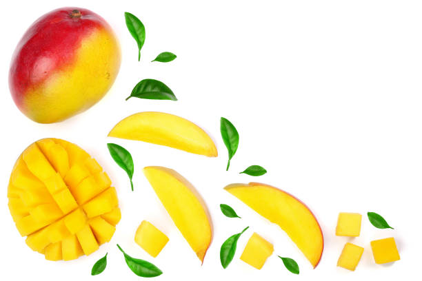 istock Mango fruit and slices decorated with leaves isolated on white background with copy space for your text. Top view 941180882